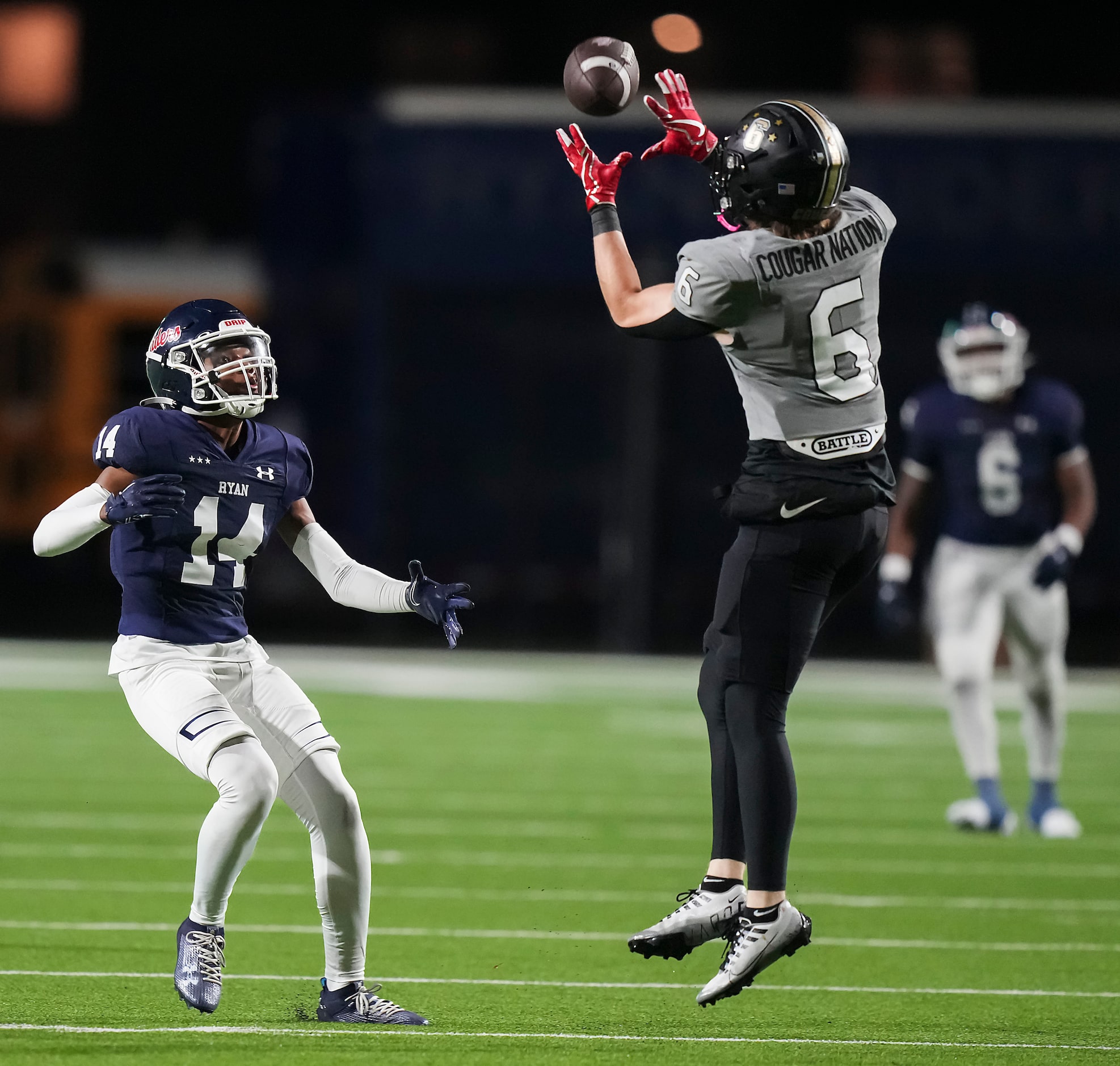 The Colony defensive back Sean Keenen (6) intercepts a pass intended for Denton Ryan wide...