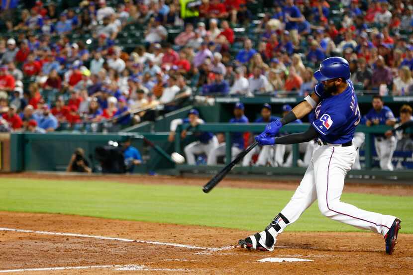 Texas Rangers right fielder Nomar Mazara (30) hits a home run in the fourth inning against...