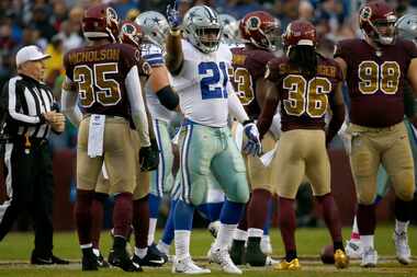 Dallas Cowboys running back Ezekiel Elliott (21) celebrates after he gets a first down...