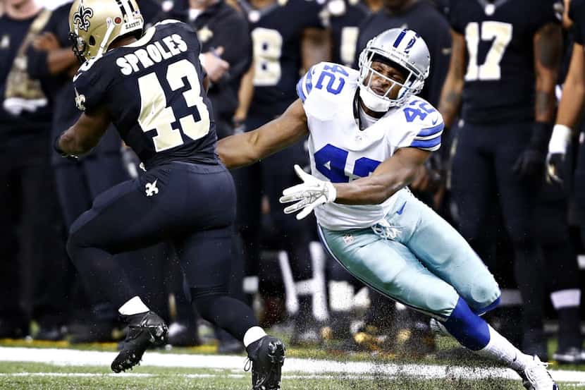 New Orleans Saints running back Darren Sproles (43) gets past Dallas Cowboys free safety...