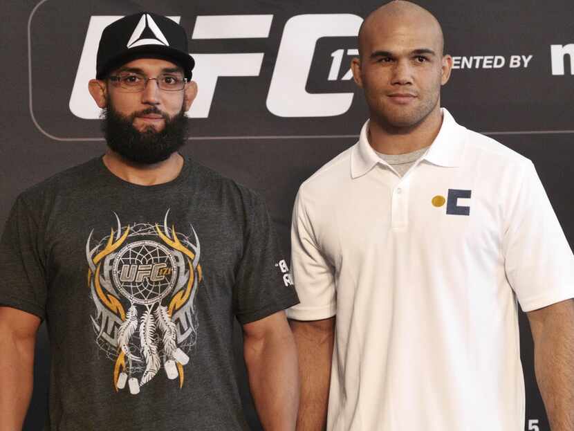 Johny Hendricks (left) and his opponent Robbie Lawler pose for the media at the UFC World...