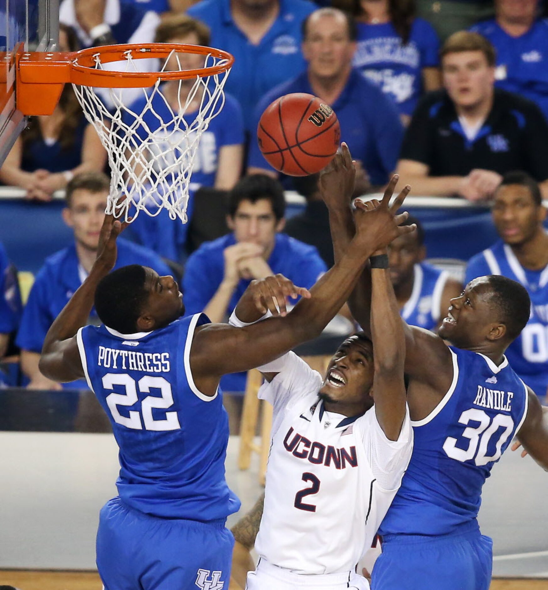 Connecticut Huskies forward DeAndre Daniels (2) hauls in a rebound between Kentucky Wildcats...