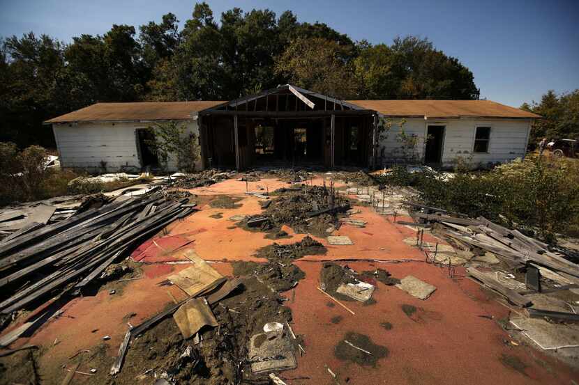 Parts of the New Jerusalem Baptist Church have been dismantled near Honey Grove in...