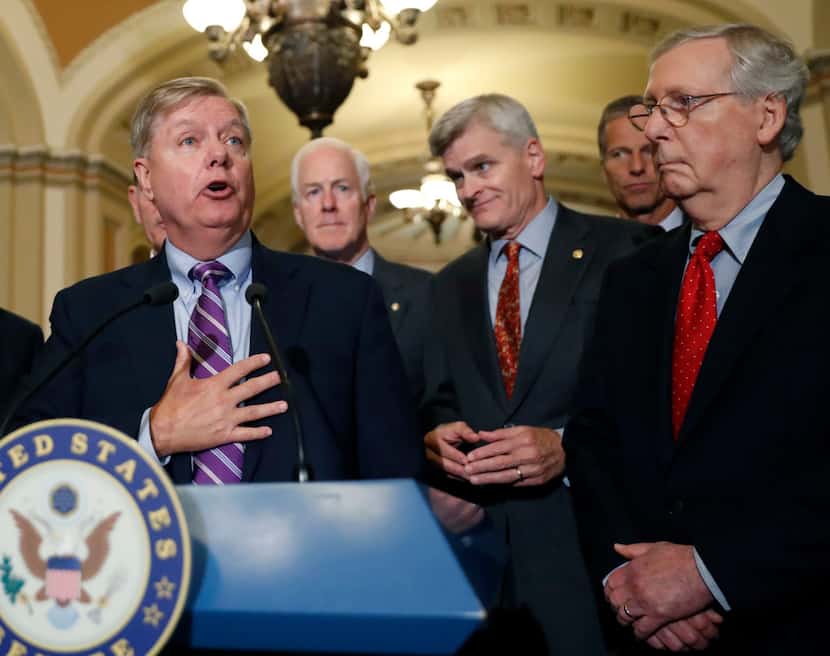 Sen. Lindsey Graham, R-S.C., speaks to the media, accompanied by Senate Majority Whip Sen....
