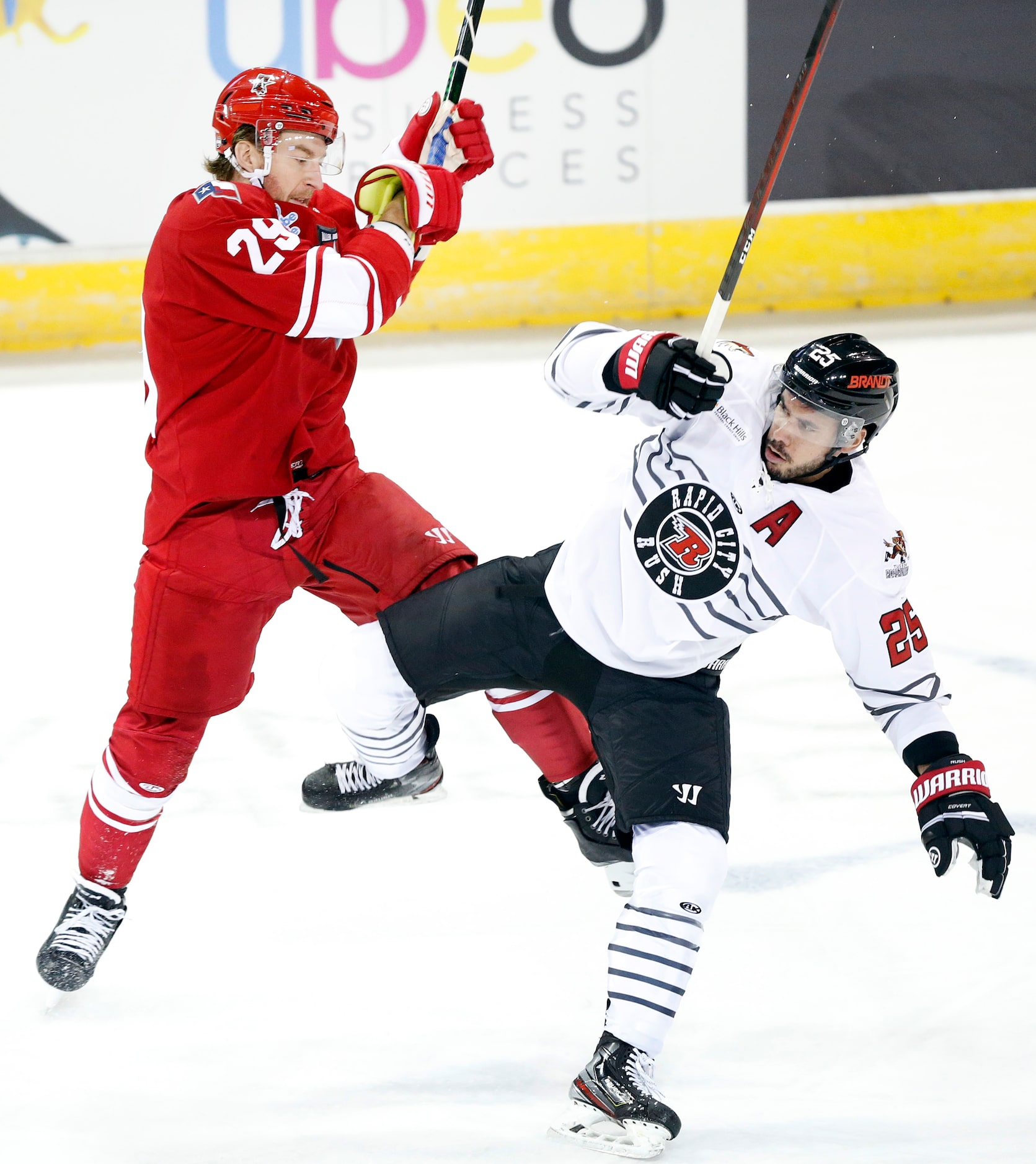 Allen Americans forward Jesse Mychan (29) collides with Rapid City Rush defenseman Mikael...