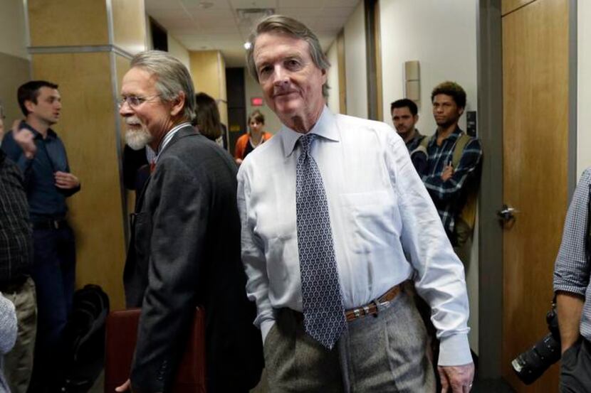 
University of Texas at Austin President Bill Powers (center) waited to return to a UT Board...