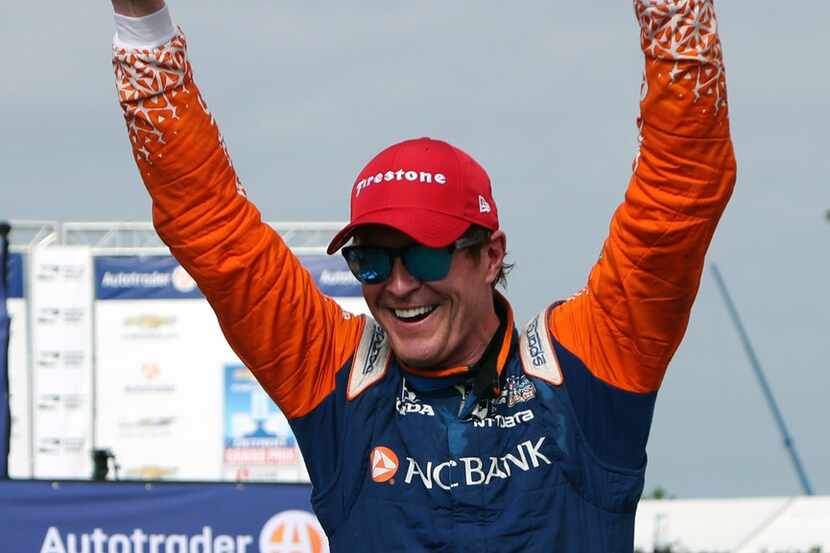 FILE - In this June 2, 2018, file photo, Scott Dixon, of New Zealand, celebrates after...