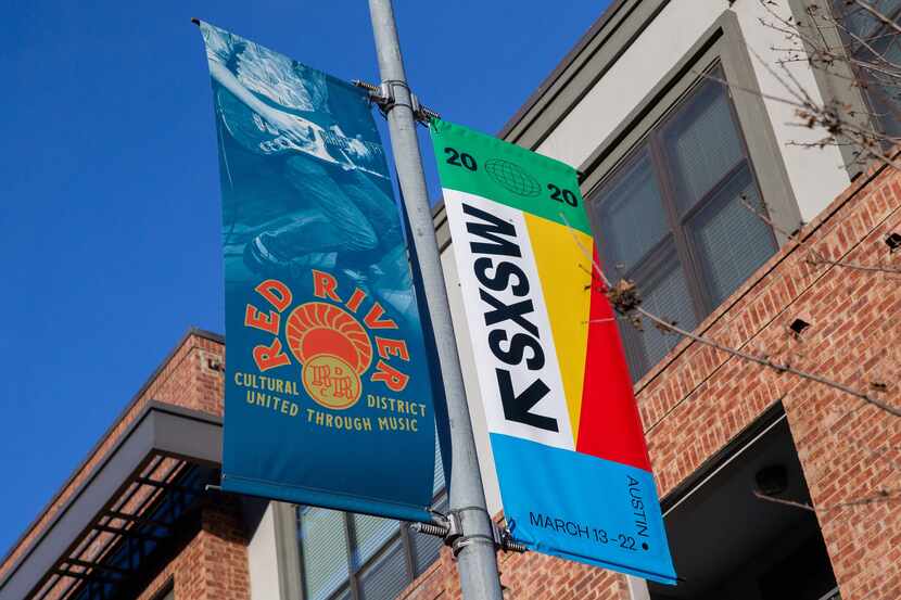 SXSW 2020 banners are seen in Austin on March 6, 2020 in Austin Texas. The South by...