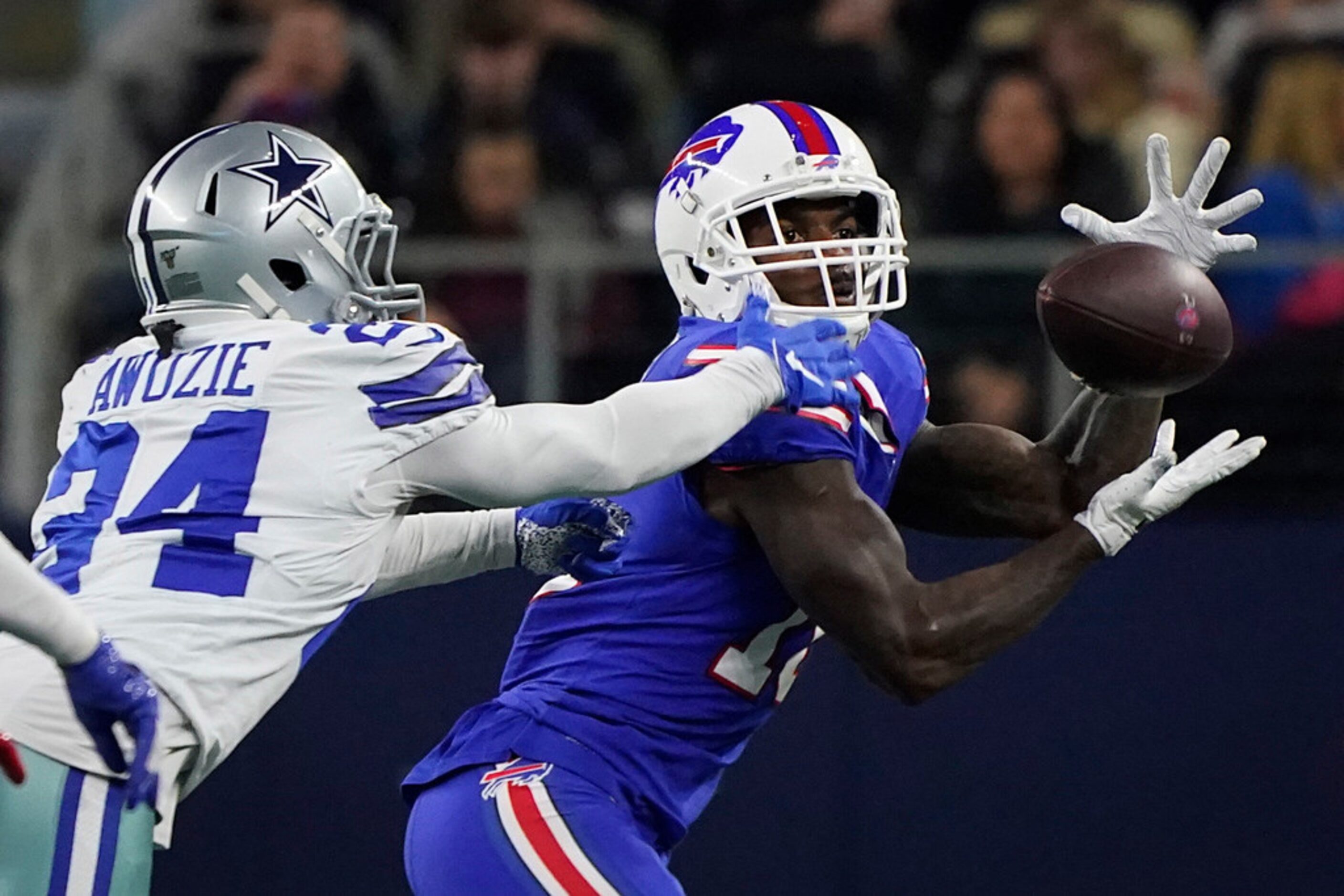 Buffalo Bills wide receiver Robert Foster (16) makes a catch as Dallas Cowboys cornerback...