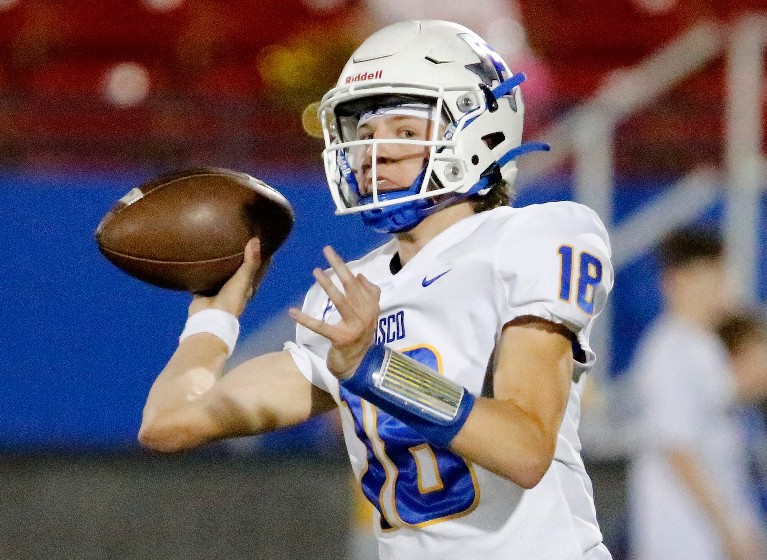 Frisco High School quarterback Camren Gibson (18) throws a pass during the first half as...