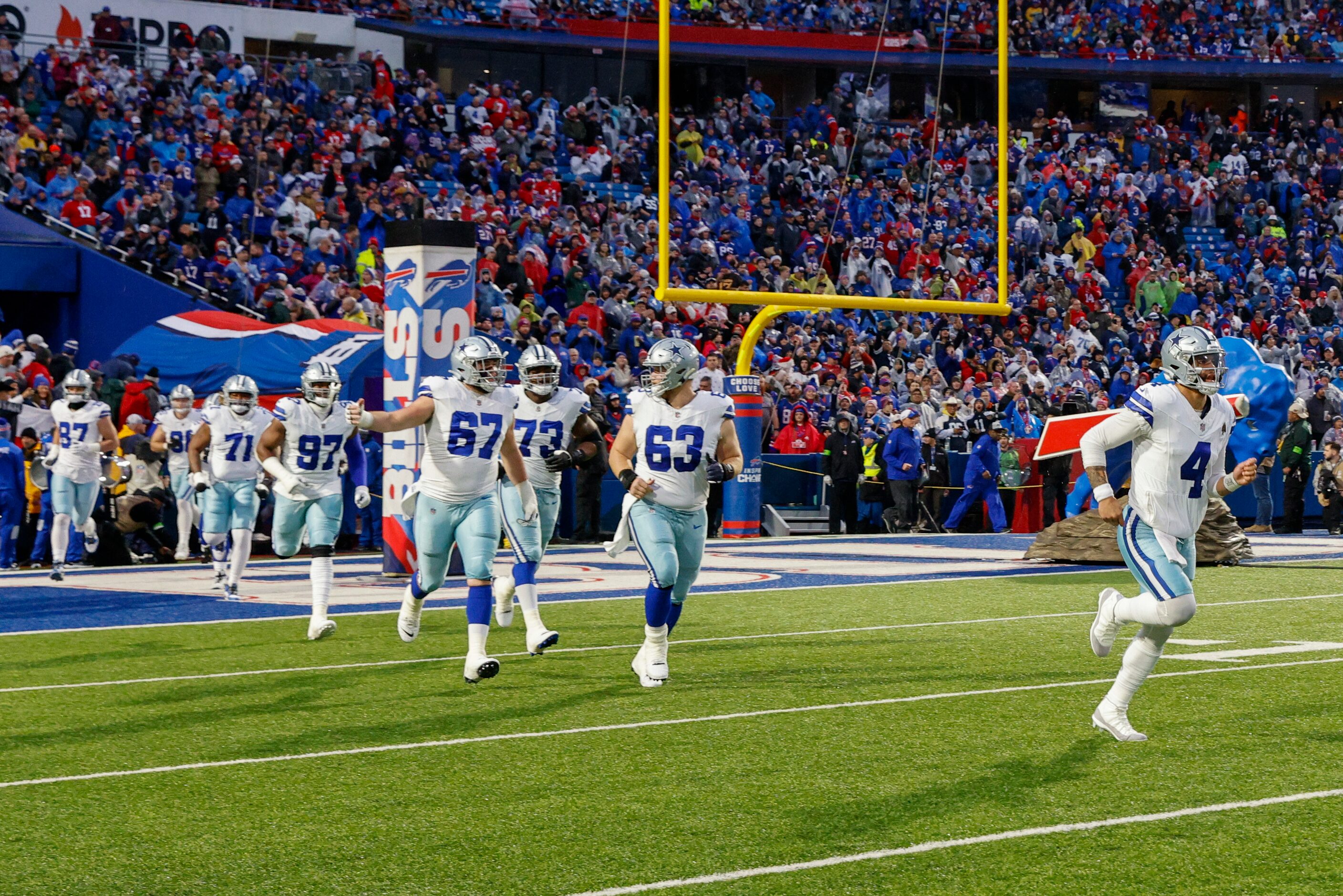 Dallas Cowboys quarterback Dak Prescott (4) takes the field ahead of center Brock Hoffman...