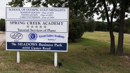 A sign at the entrance to Spring Creek Academy in Plano honors graduates including Carly...