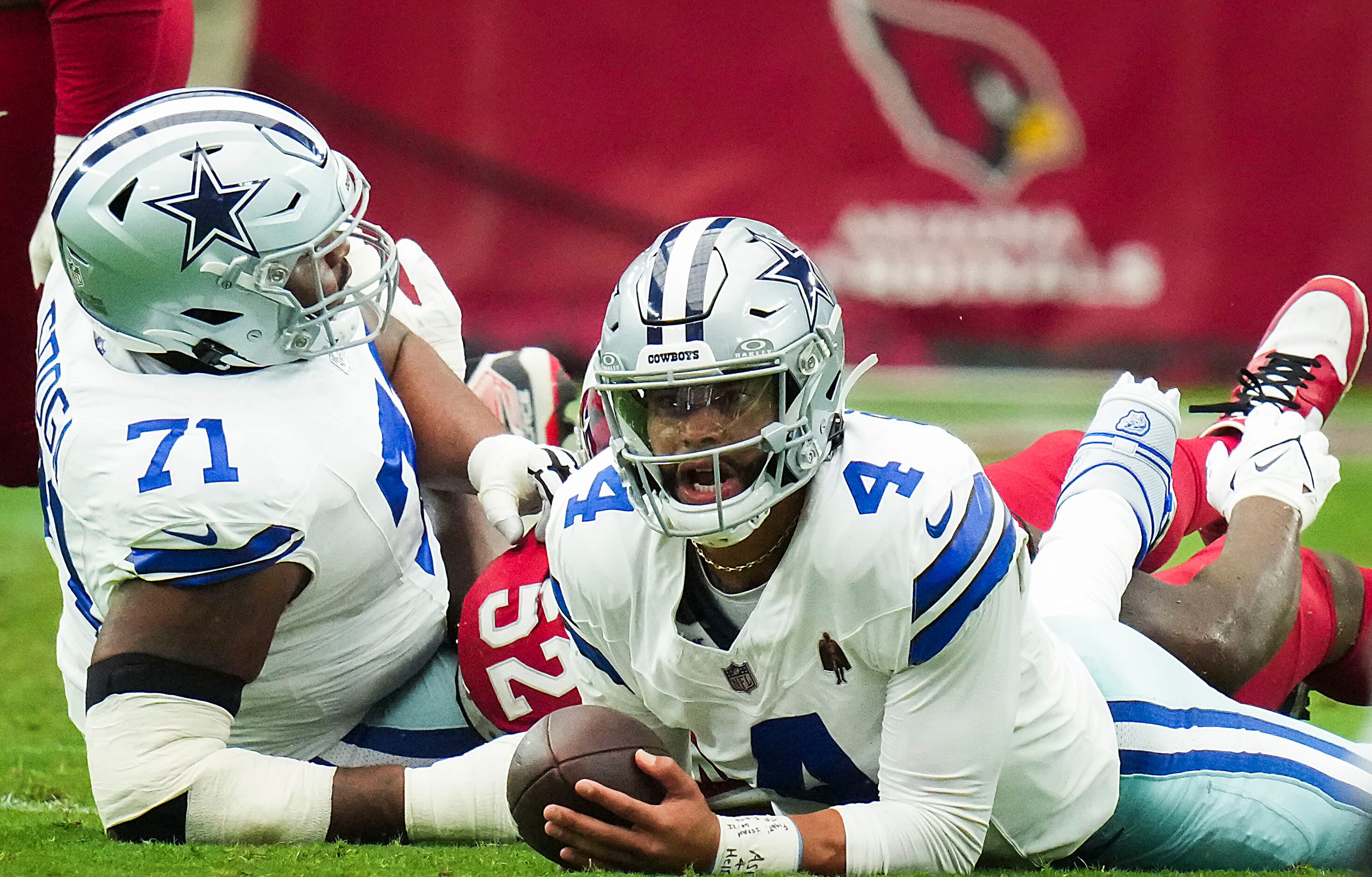 Dallas Cowboys quarterback Dak Prescott (4) reacts after being sacked by Arizona Cardinals...