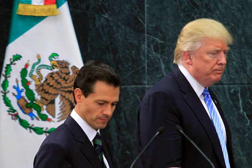Donald Trump, at a joint news conference with Mexican President Enrique Pena Nieto after...