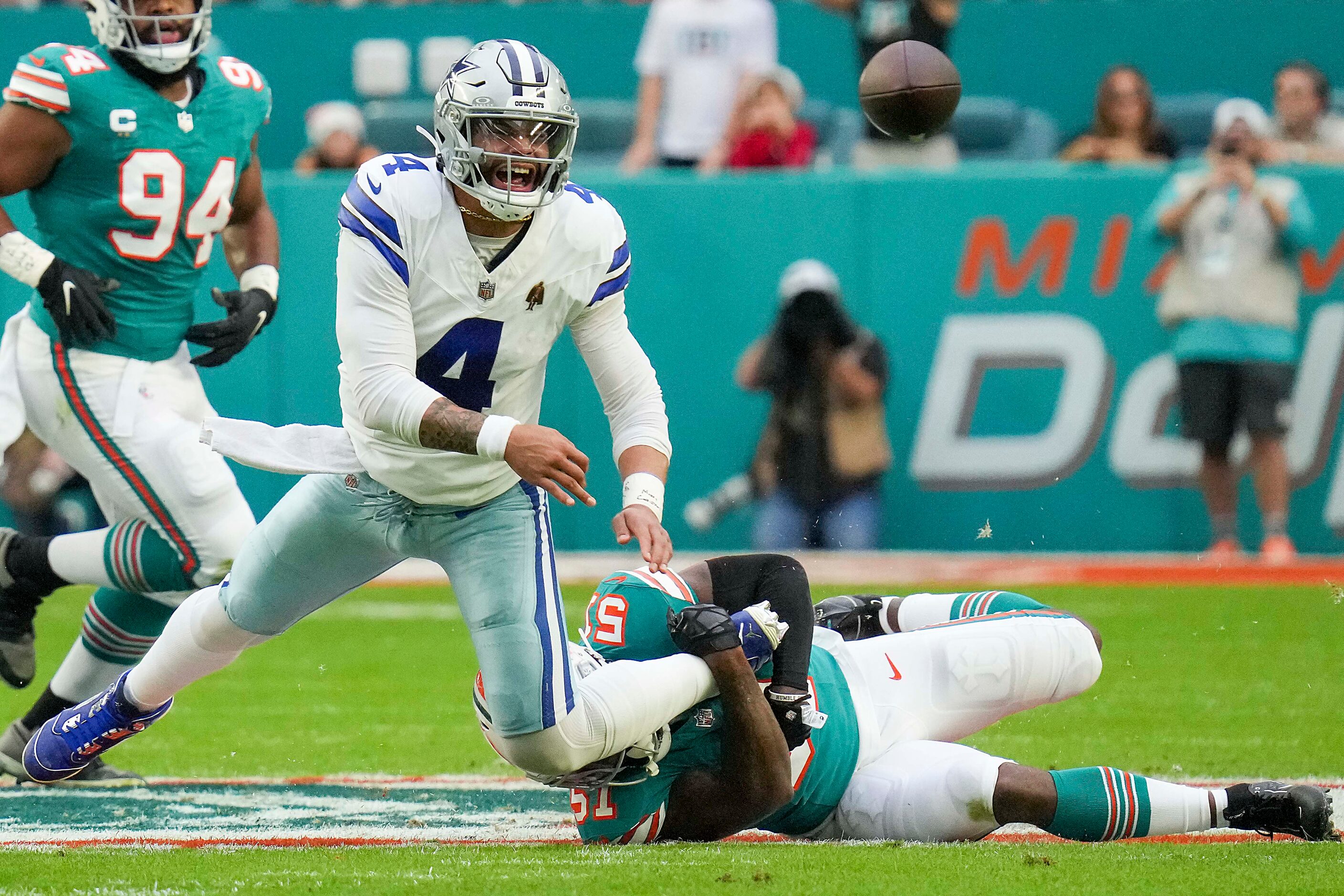 Dallas Cowboys quarterback Dak Prescott (4) throws an incomplete pass under pressure from...