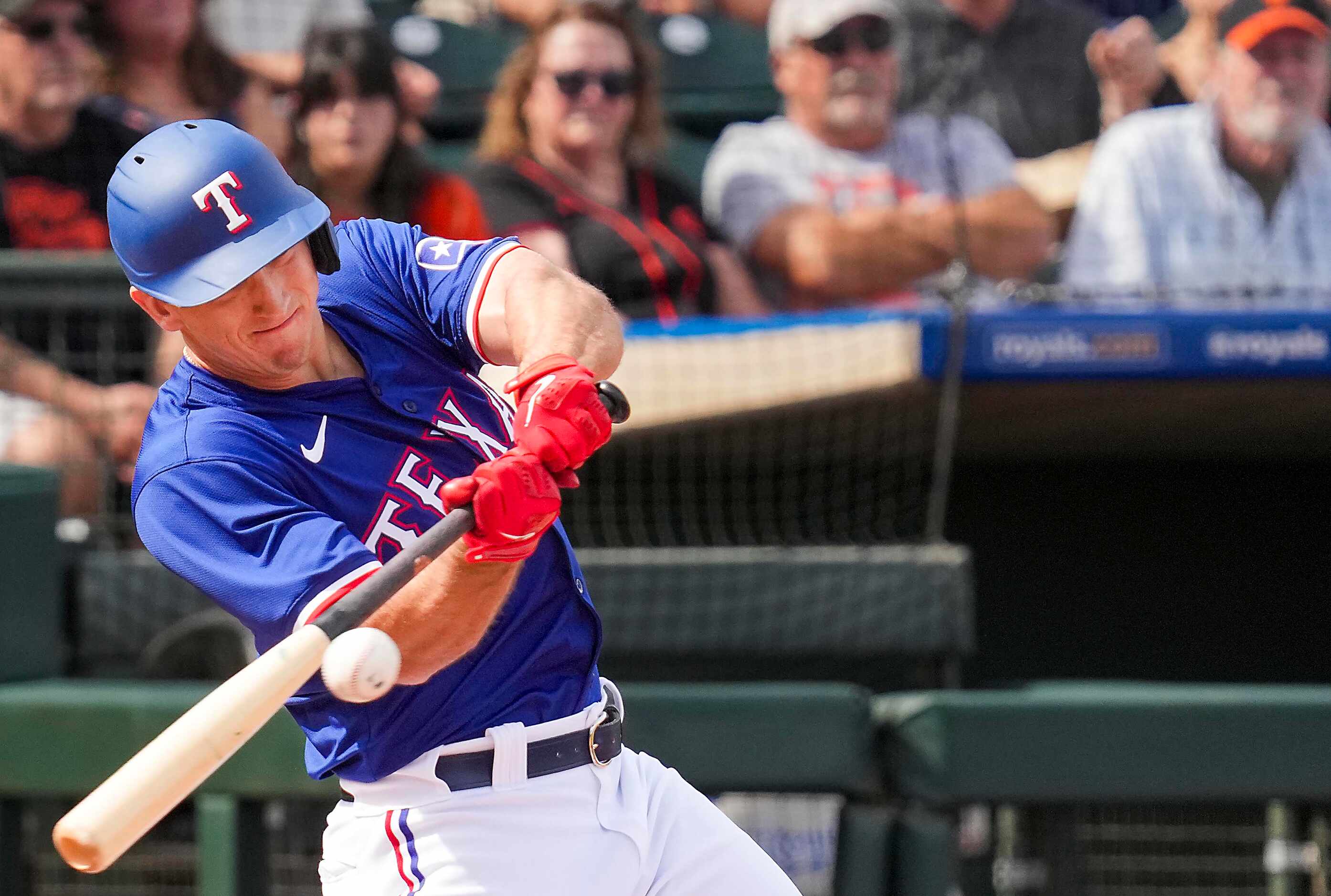 Texas Rangers outfielder Wyatt Langford bats during the first inning of a spring training...
