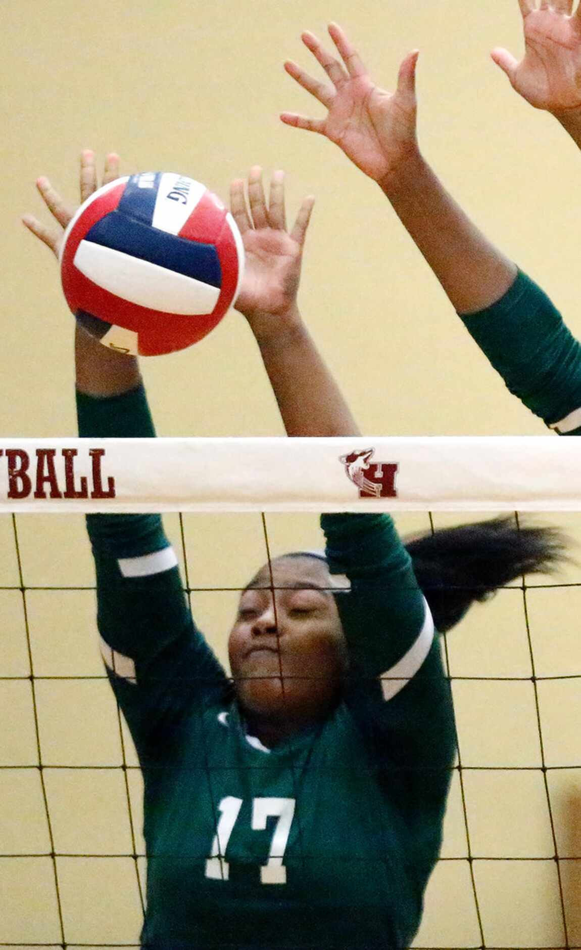 Lebanon Trail High School opposite Rani Williams (17) gets a block during game two as...
