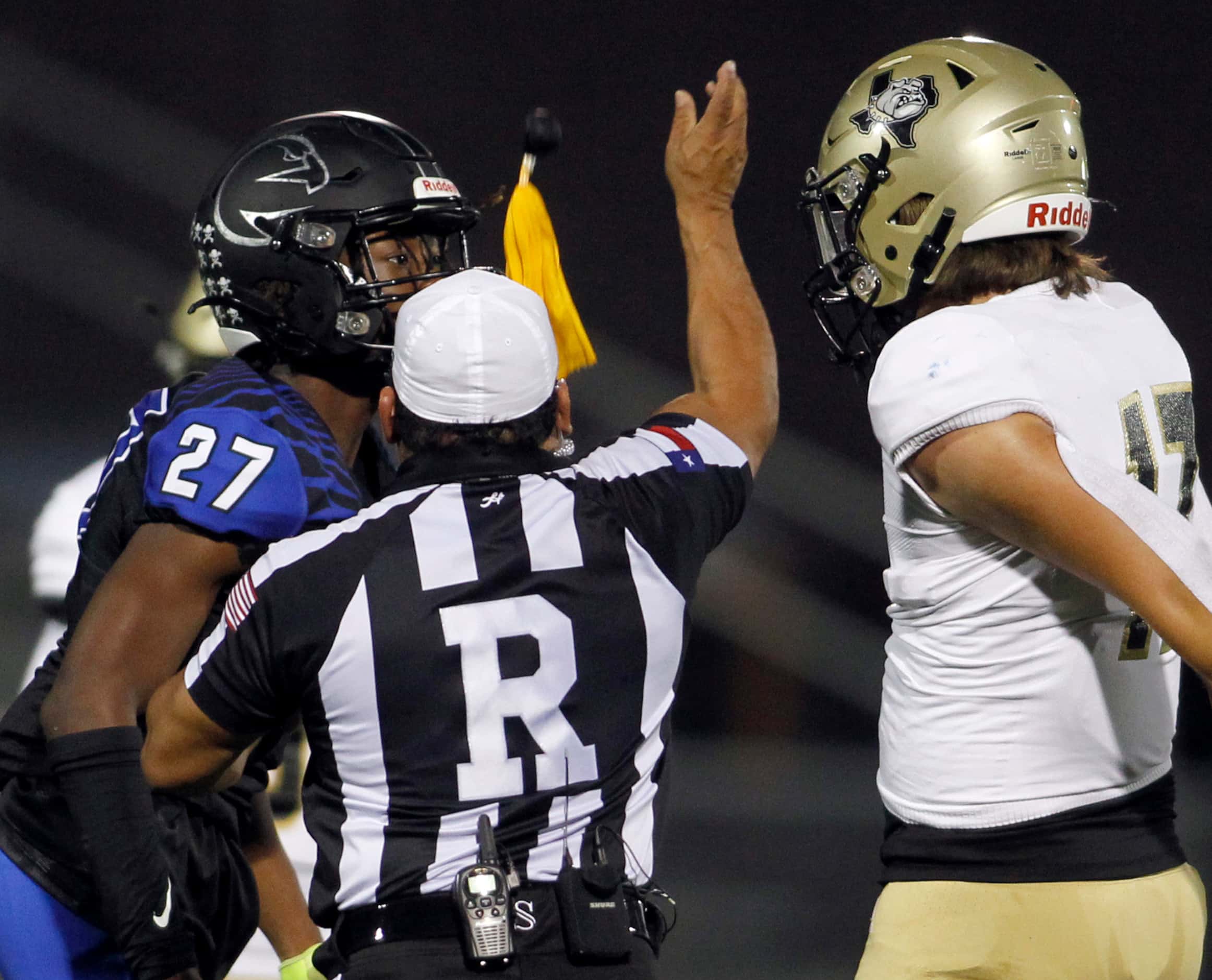 North Forney's Gianni Edwards (27) and Royse City's Hayden Herndon (17) were flagged for...