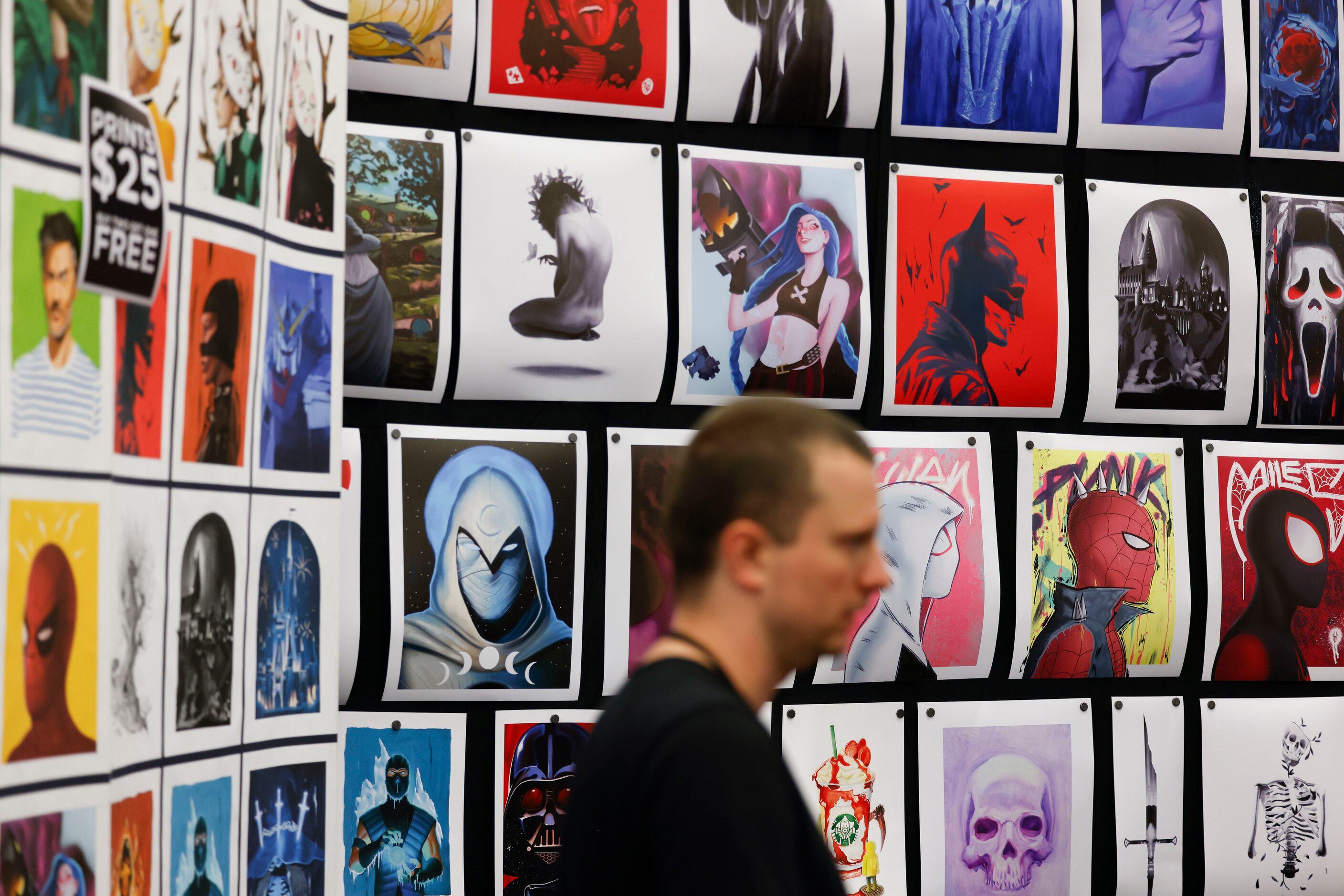 Movie and anime posters hang on a shop during Fan Expo Dallas on Friday, June 9, 2023, at...