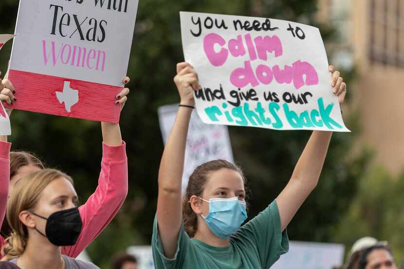 FILE -People take part in the Women's March ATX rally, Saturday, Oct., 2, 2021 in at the...