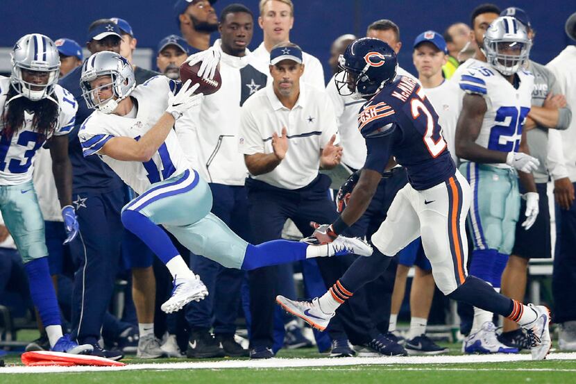 Dallas Cowboys wide receiver Cole Beasley (11) is pushed out of bounds by Chicago Bears...