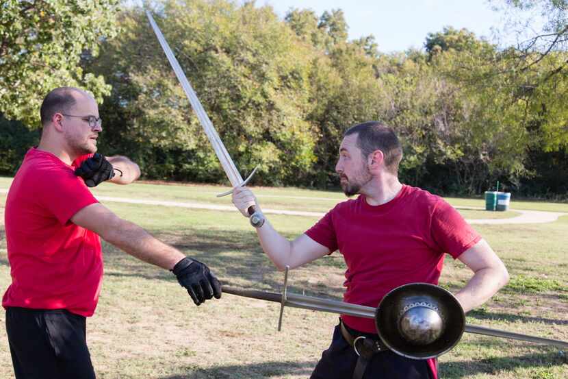 ARMA members, Curtis Rochelle, left, and Ben Morgan perform a sword grab at South Lakes...