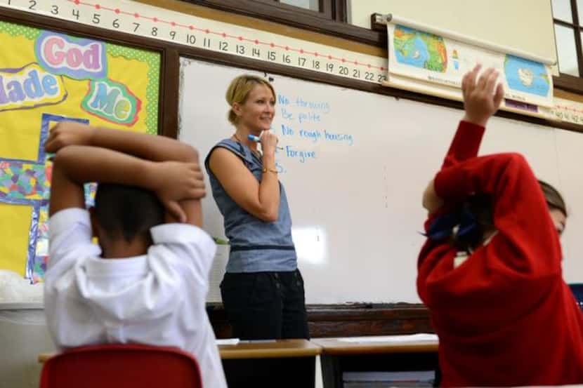 
Second-grade teacher Susan Flusche makes a list of rules with her class on the first day of...
