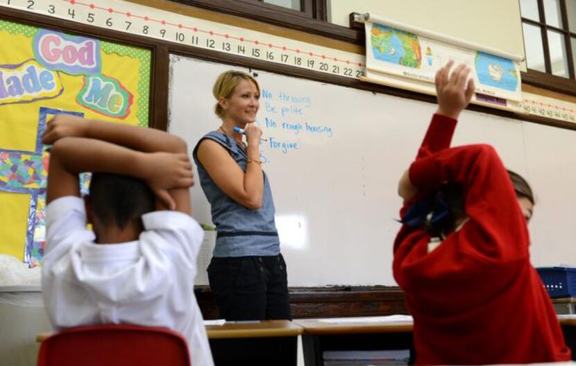 
Second-grade teacher Susan Flusche makes a list of rules with her class on the first day of...