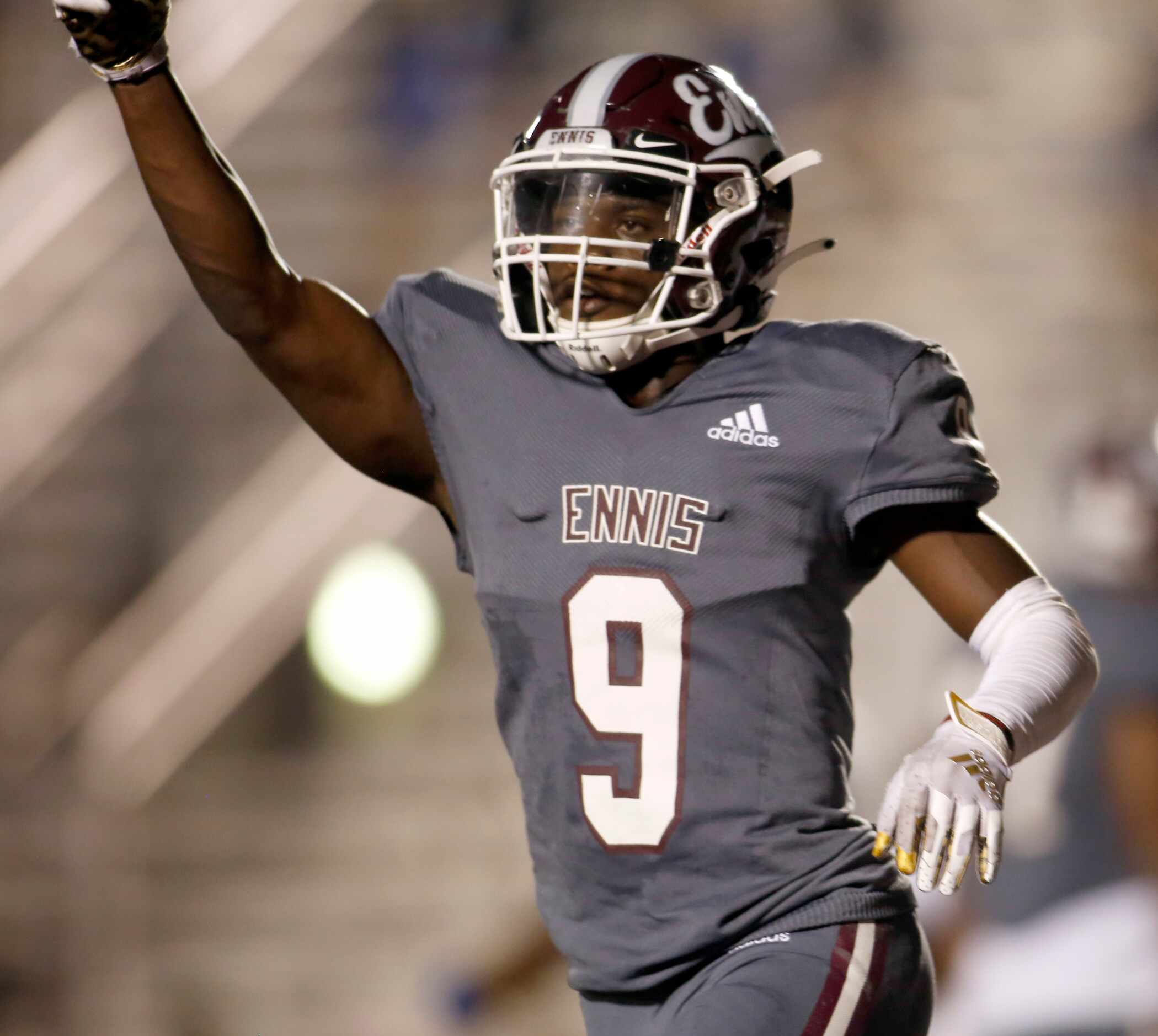 Ennis receiver Devion Beasley (9) celebrates his first quarter touchdown as he gestures to...