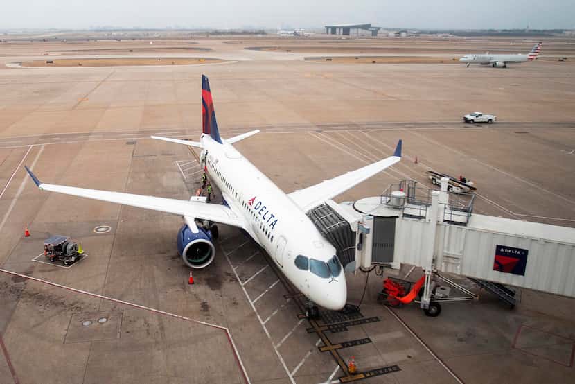 Delta's new Airbus A220-100 airplane sits parked at gate E15 of Terminal E at DFW Airport on...