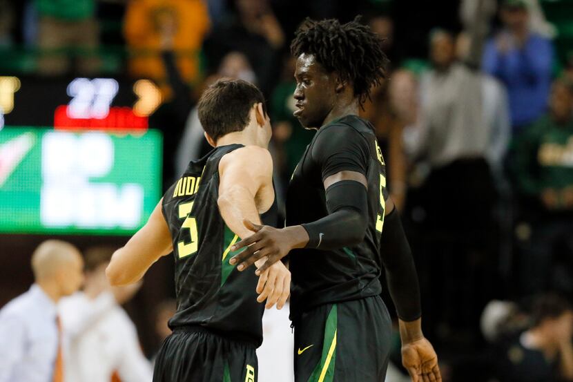 Baylor's Jake Lindsey (3) and Johnathan Motley, right, celebrate during the first half of an...