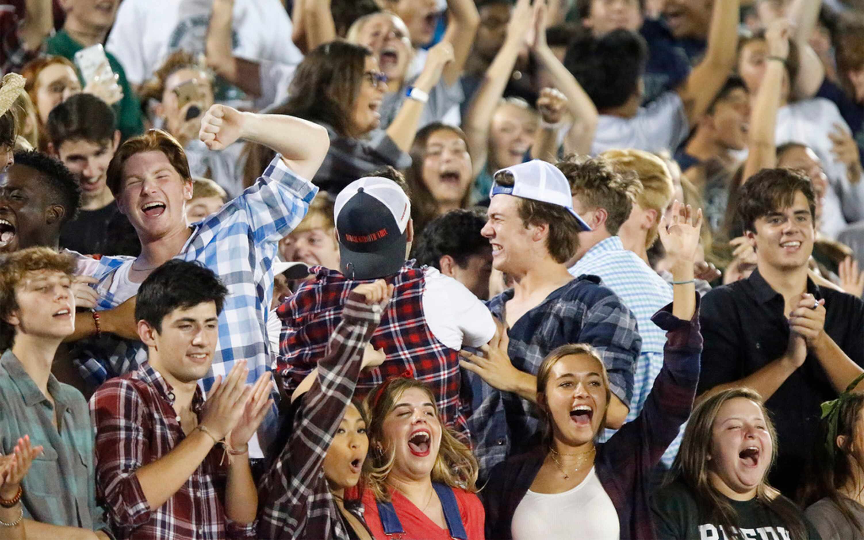 The Reedy High School student section reacts to a touchdown which put them up 17-7 during...