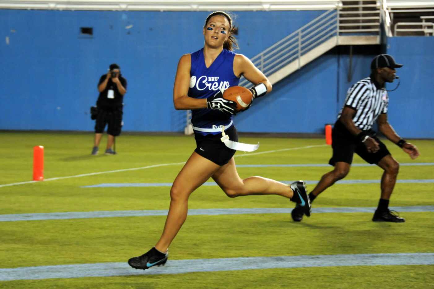 Jade Randle runs with the ball at Blondes vs. Brunettes powder-puff football game at The...