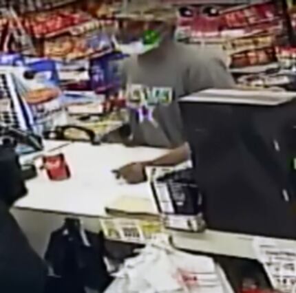 One robber wore a Cowboys shirt and had a surgical mask on his chin.