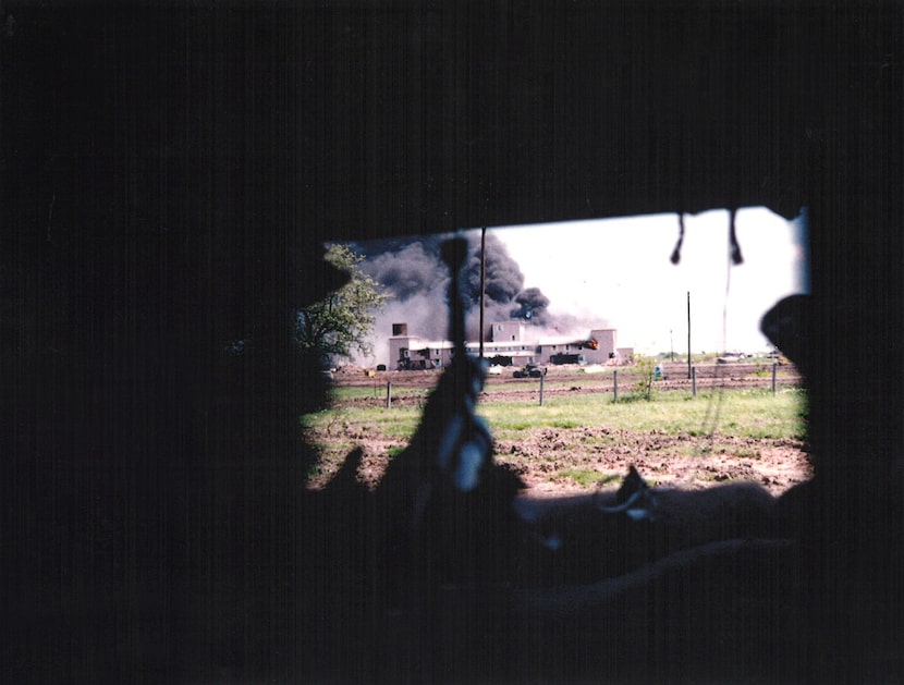 A FBI Hostage Rescue Team photo taken from one of the government's sniper positions as fire...