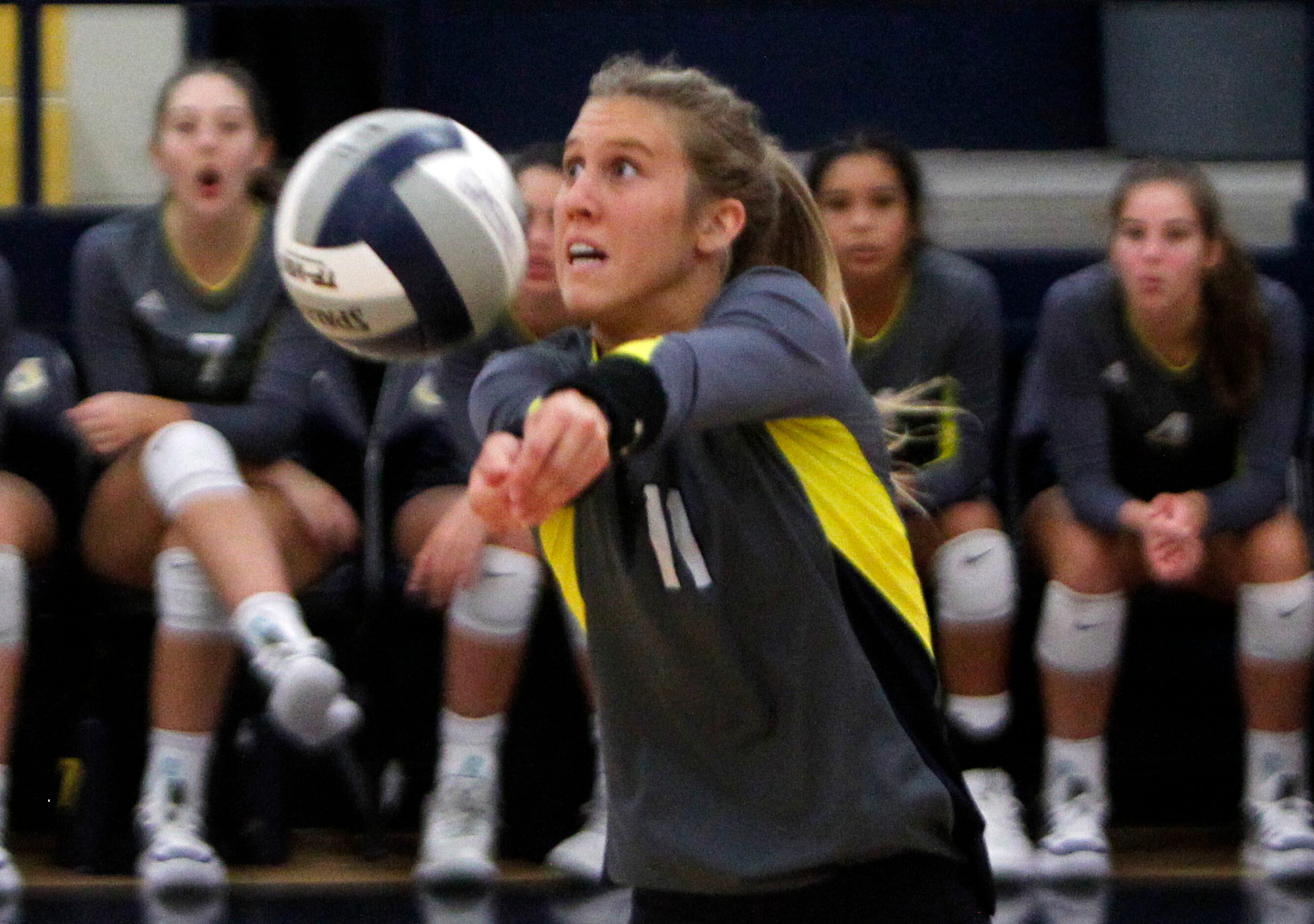 Highland Park outside hitter Sydney Breon (11) sets the ball for a teammate during the 3rd...