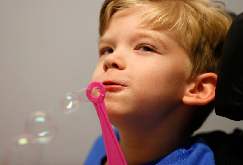 Will blows bubbles at Keystone Pediatric Therapy in McKinney, Texas, Wednesday, June 20, 2018.