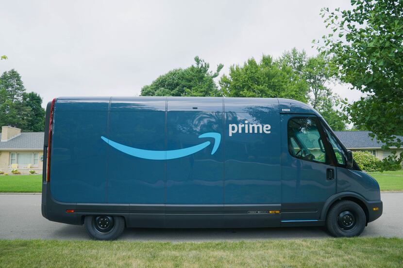 An amazon electric delivery van made by Rivian. Amazon has invested in Rivian and ordered...