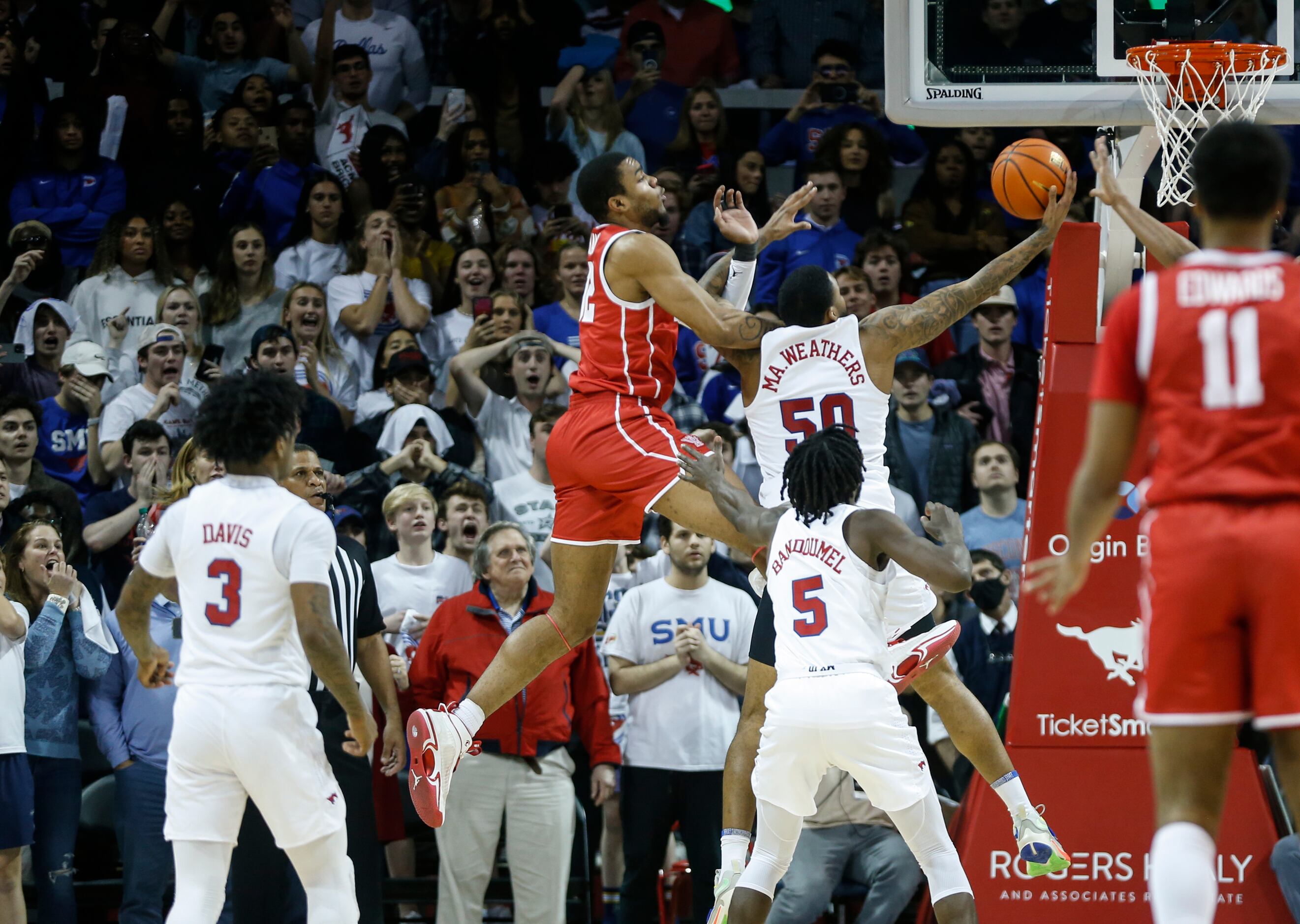 Houston Cougars forward Reggie Chaney (32) jumps while Southern Methodist Mustangs forward...