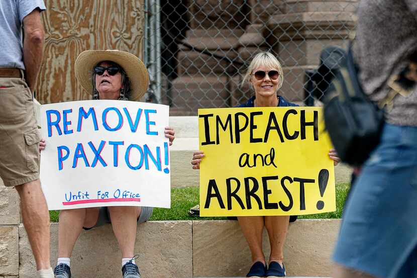 Stephanie Lucie (right) and Lynn Tozser (left) protested in favor of impeaching Texas...