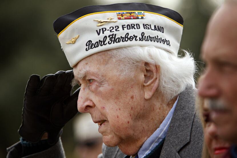 Charles Peters of Euless, who was a career Navy aviator and a Pearl Harbor veteran, salutes...