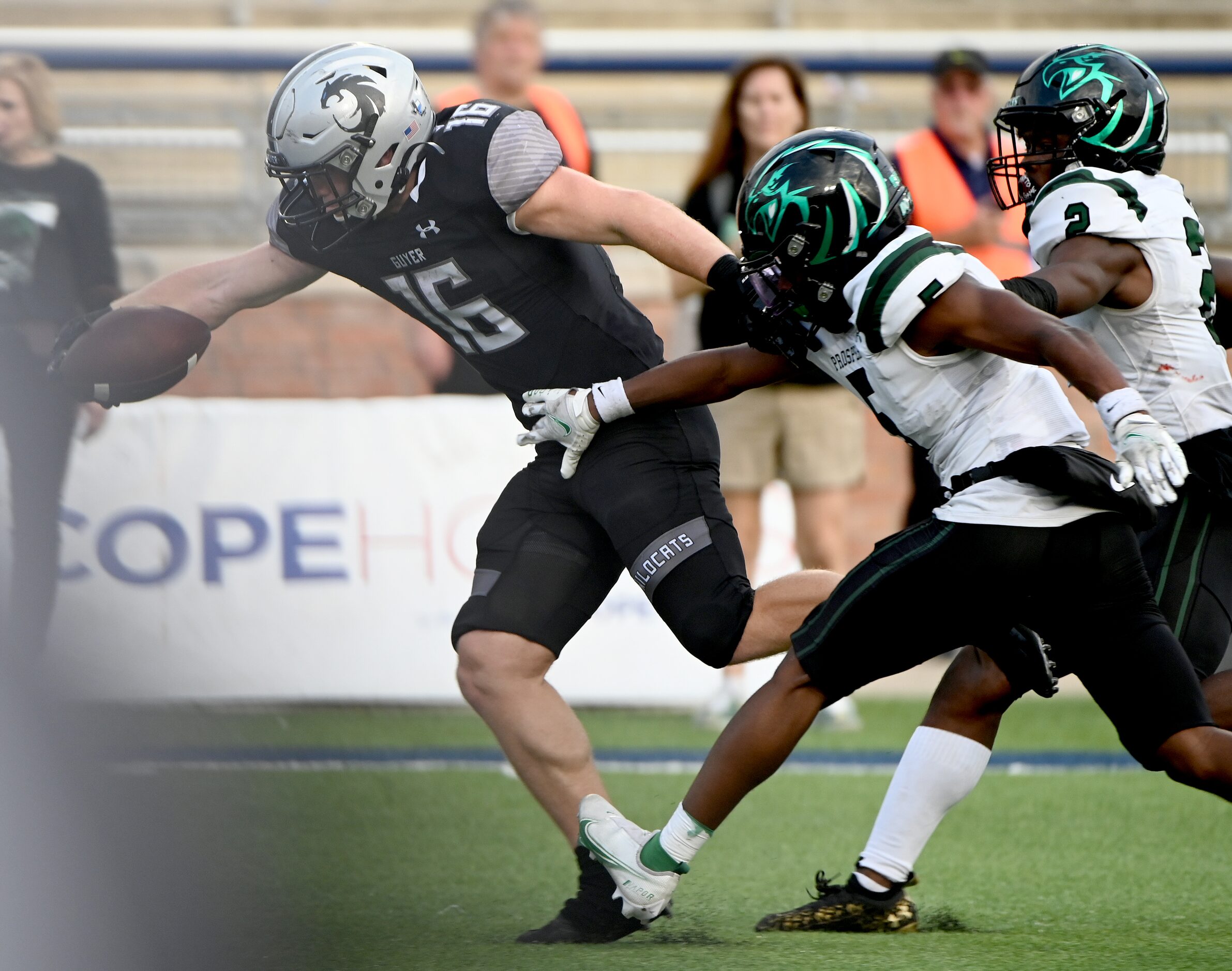 Denton Guyer's Jackson Foster (16) reaches for the goal line for Guyer’s final touchdown of...