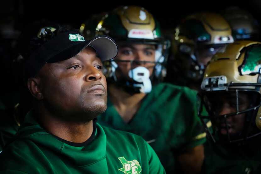 DeSoto head coach Claude Mathis looks out from the tunnel before the first half of 6A...