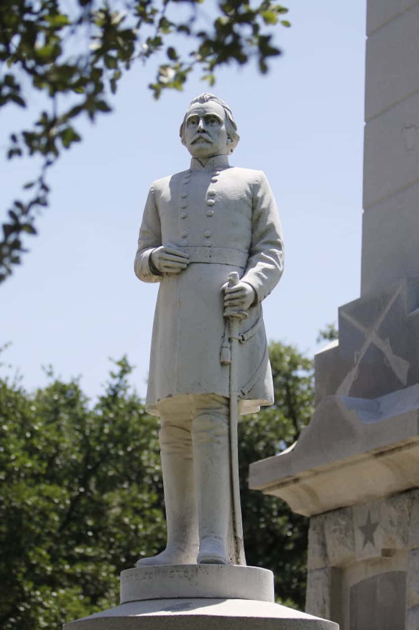 An Albert S. Johnston statue stands outside a Confederate memorial in Pioneer Park Cemetery...