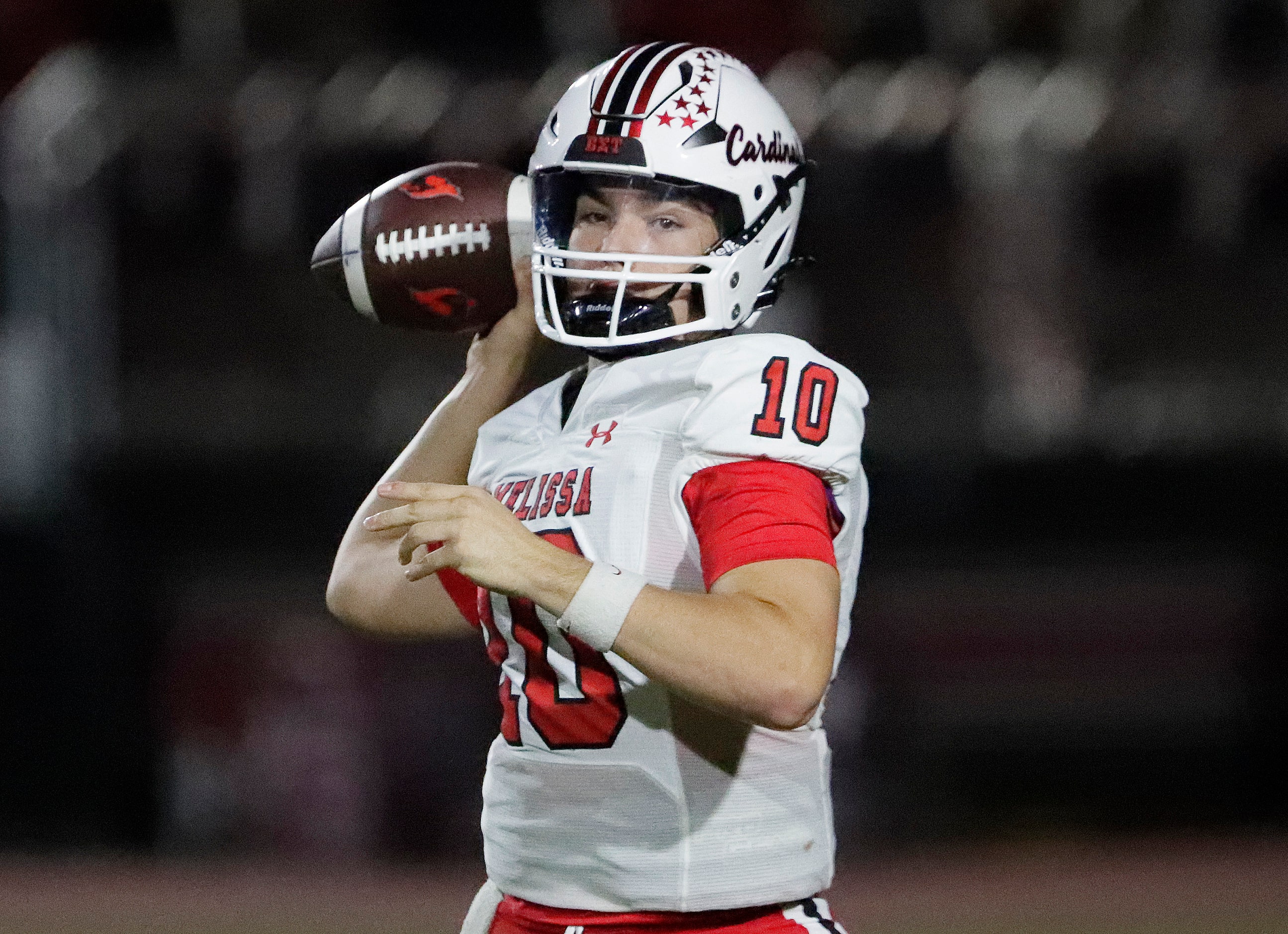 Melissa High School quarterback Noah Schuback (10) throws a pass during the first half as...