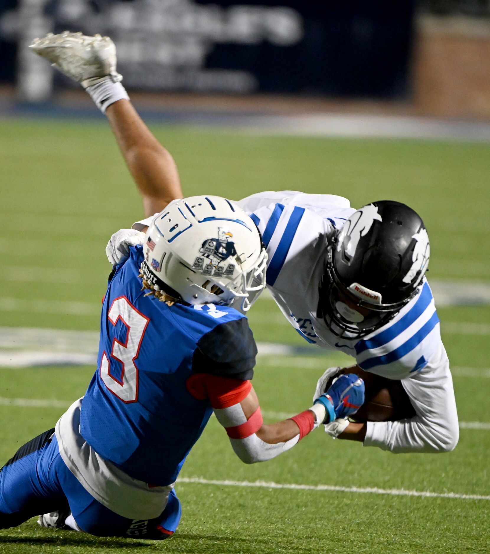 Allen’s Matthew Tousant (3) tackles Plano West’s Tyler Harrell in the first quarter of a...