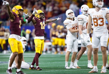 Arizona State Sun Devils defensive backs Keith Abney II (1) and Javan Robinson (12) signal...