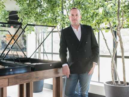 Man standing in luxury store in front of windows