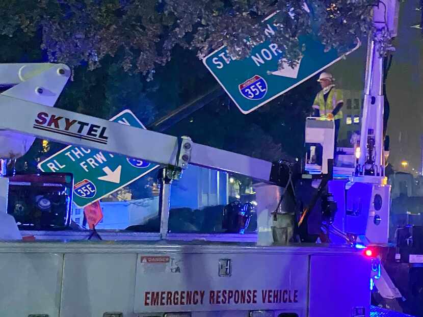 Strong storms and high winds knocked a huge street sign down on Elm Street near Houston...