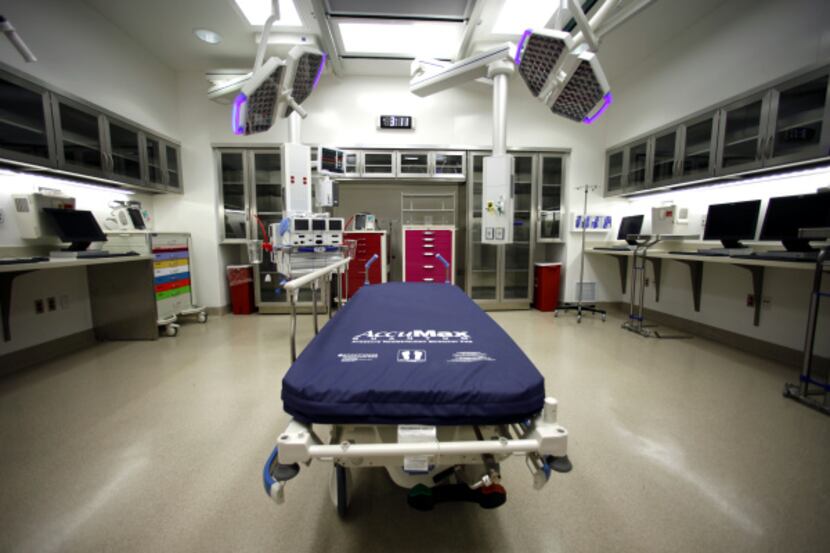 A room built out as a mock-up, subject to change, shows what an emergency room could look...